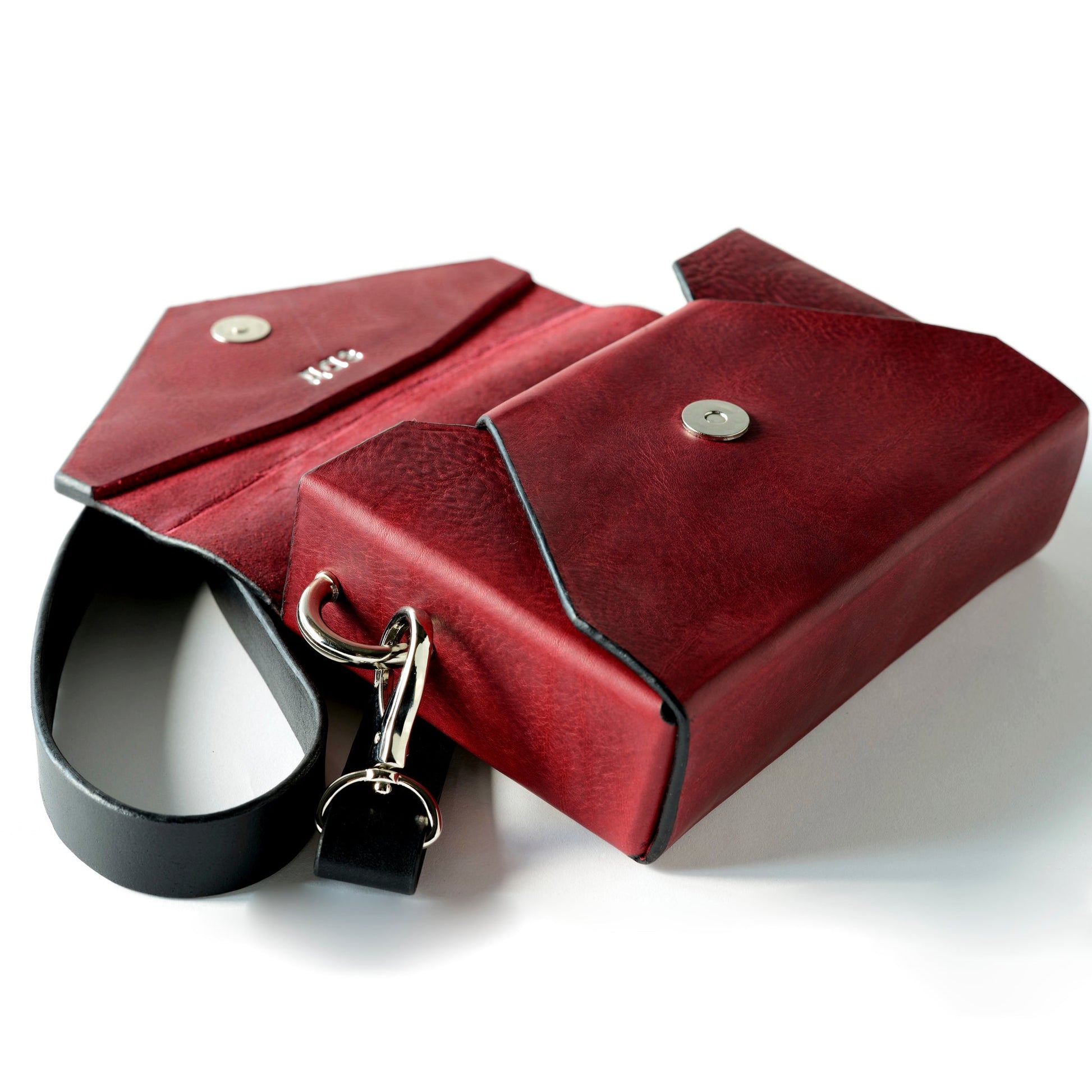 Handmade Burgundy Leather Envelope Bag with Adjustable Strap, available on USMIH Grid. Buy with card or cryptocurrency at this popular online store.