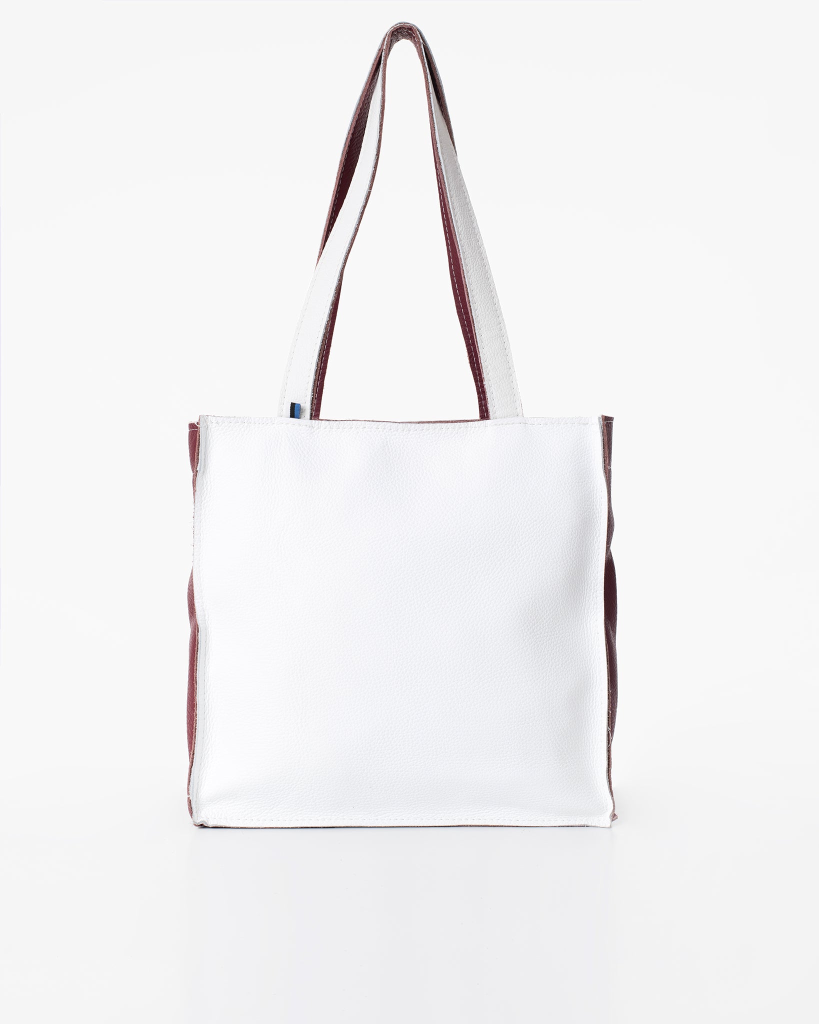 Folk 2 white leather tote bag/handbag handmade from high-quality furniture manufacturing leftovers, featuring a unique, eco-friendly design.