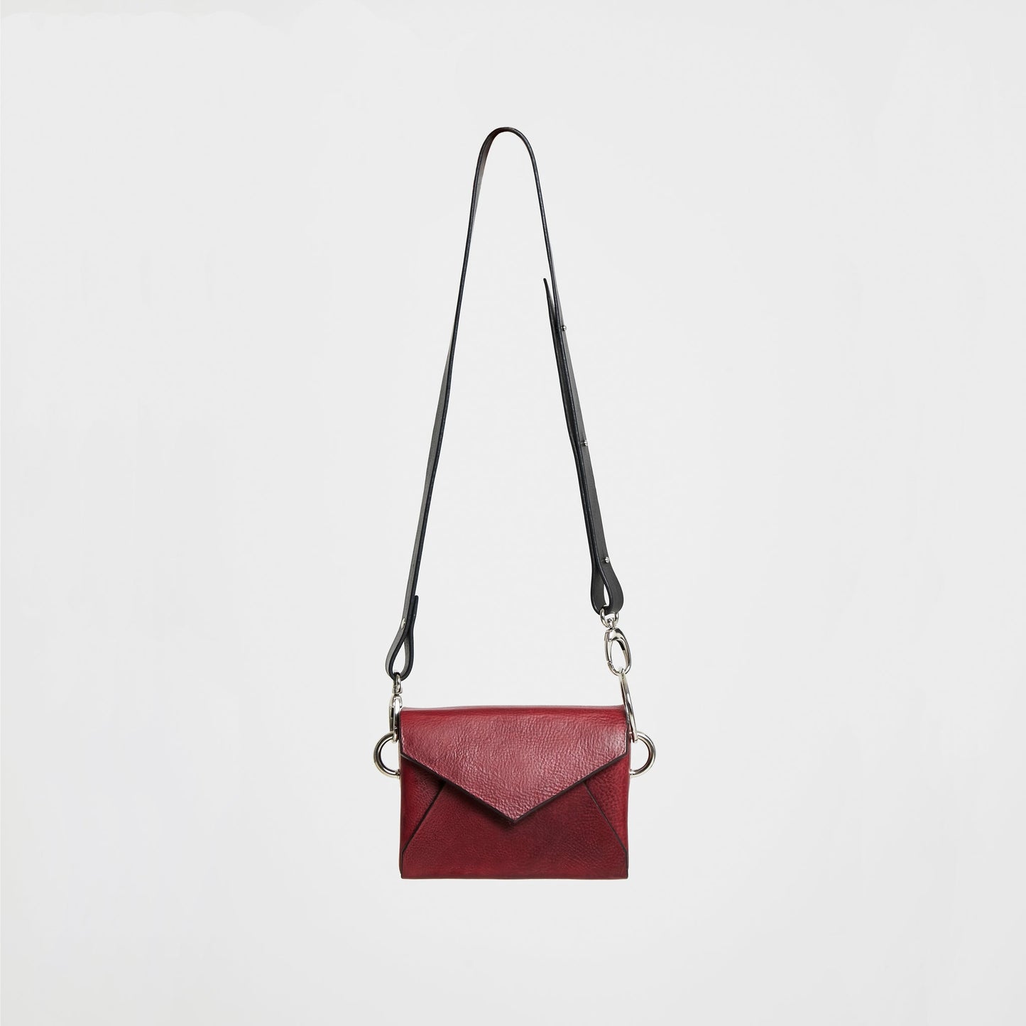 Handmade burgundy leather envelope bag with adjustable strap, available on USMIH Grid. Buy with card or cryptocurrency.