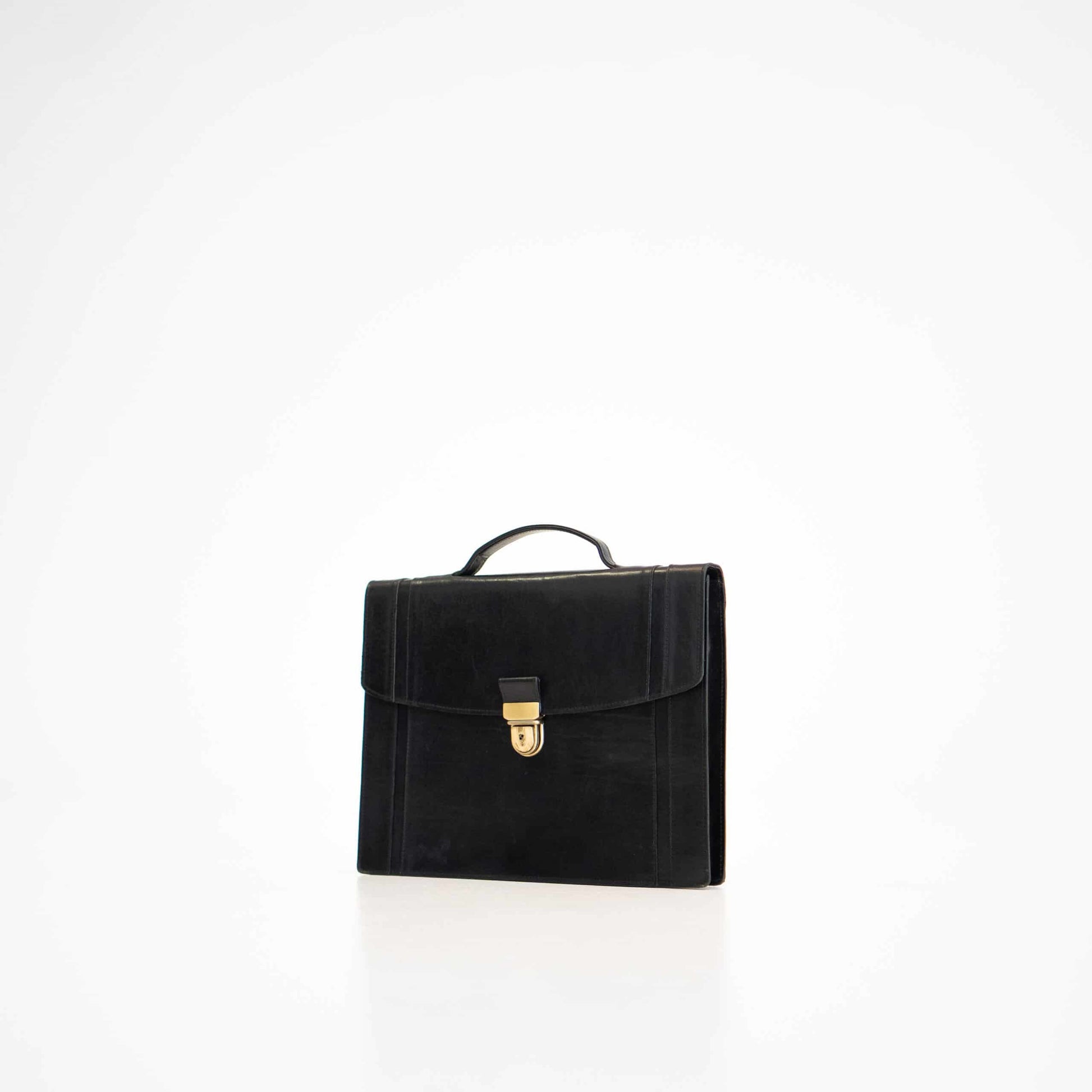 Black leather briefcase No. 21 with gold clasp, featuring elegant minimalistic design by Estonian craftsmen.