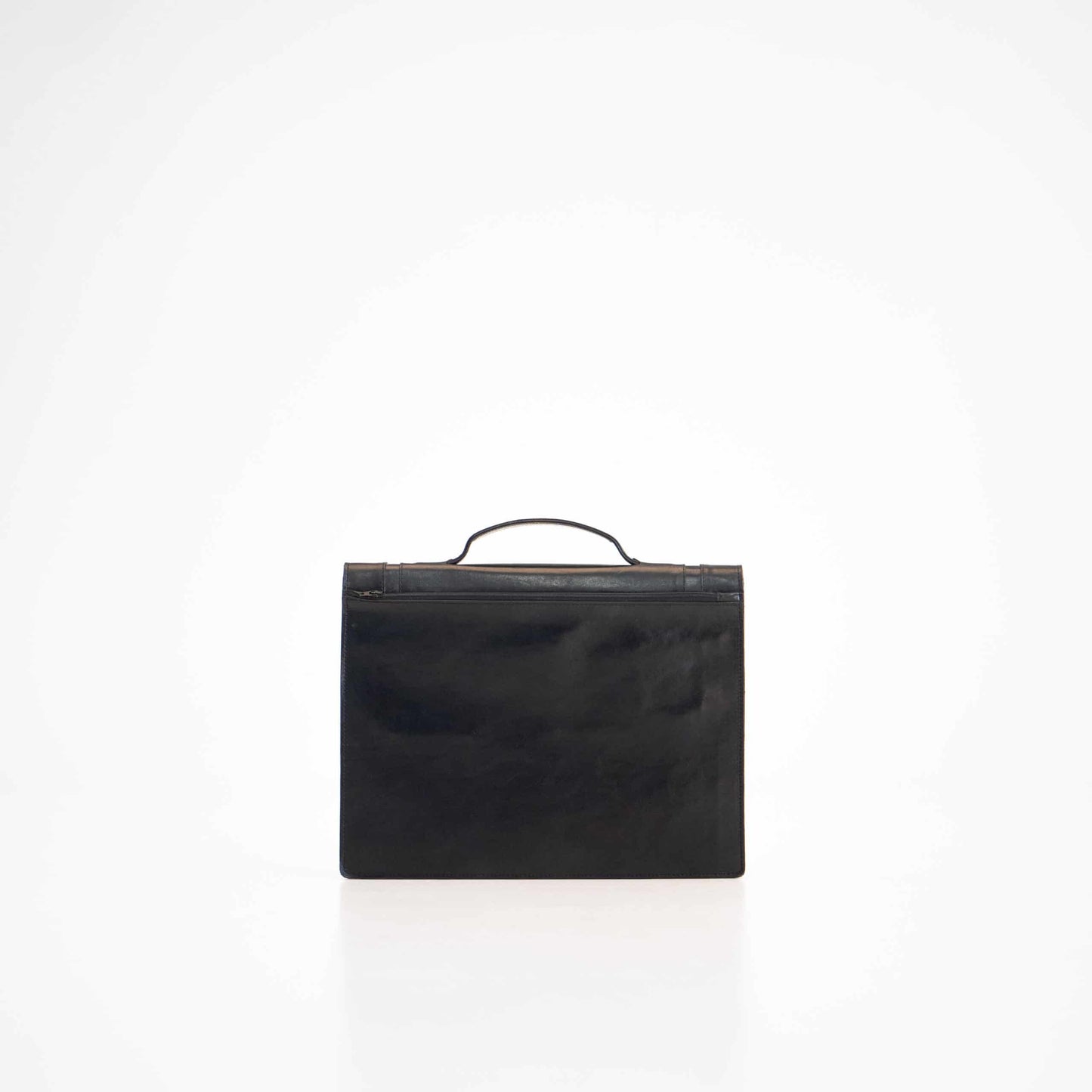 Sleek black leather Briefcase No. 21 designed for minimalism and functionality with a spacious compartment and zip pocket, handcrafted in Estonia.