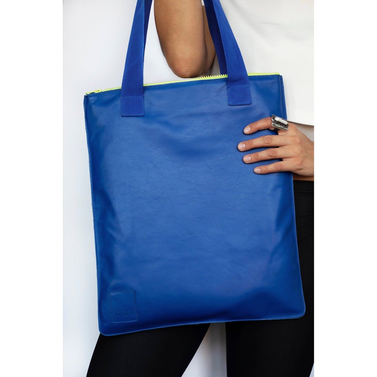 Handmade Royal Blue Leather Tote with Neon Green Zipper and Blue Straps available on USMIH Grid. Supports card and cryptocurrency payments.