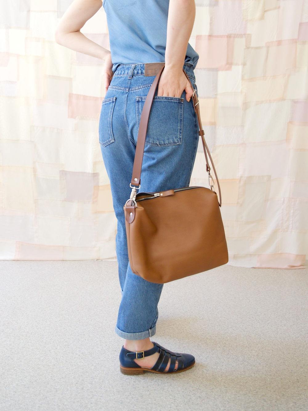 Camel Brown ROBIN Leather Handbag on woman, sold on USMIH Grid. Available for card, Bitcoin, and altcoin payments.