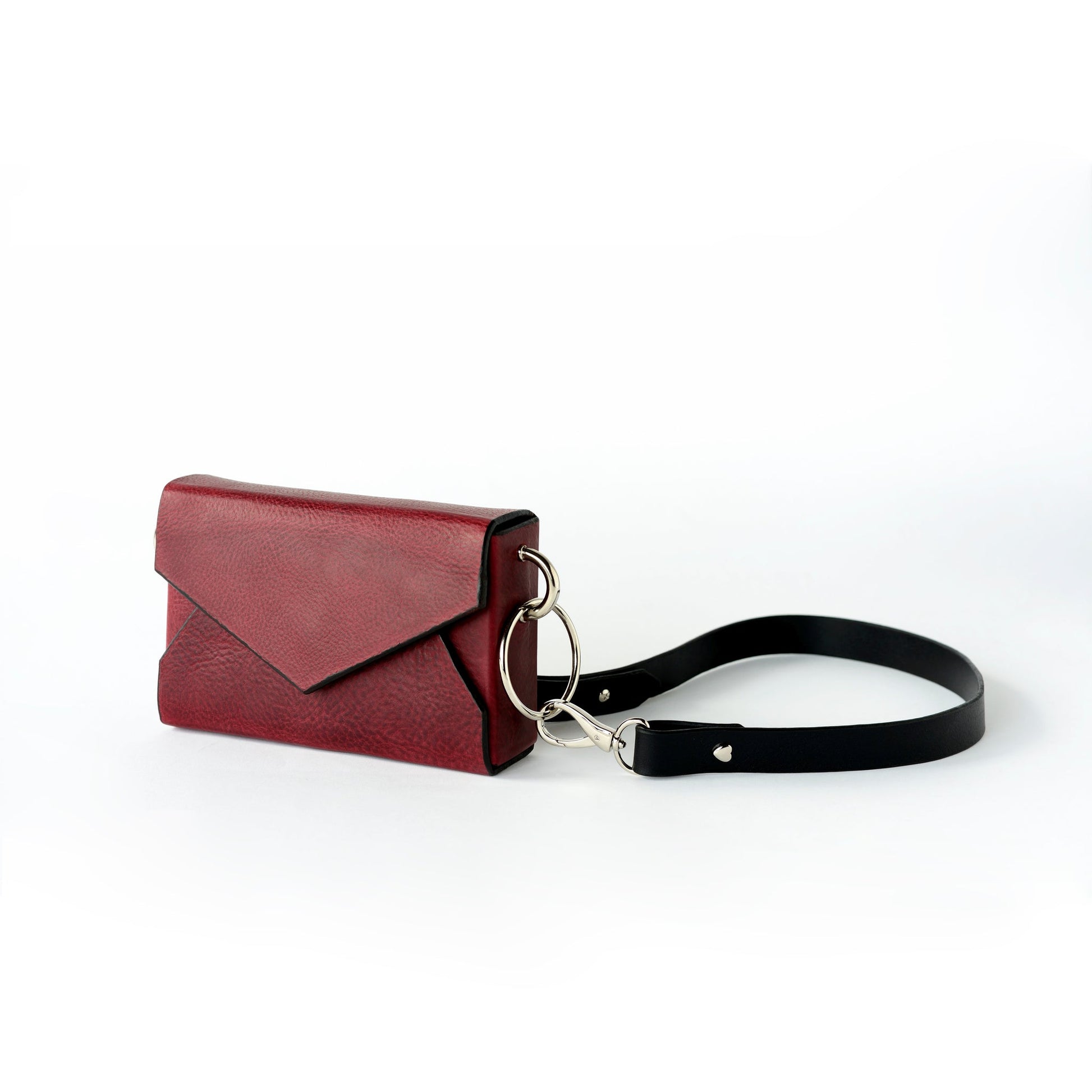 Handmade burgundy leather envelope bag with black strap on USMIH Grid, available for card and cryptocurrency payments.