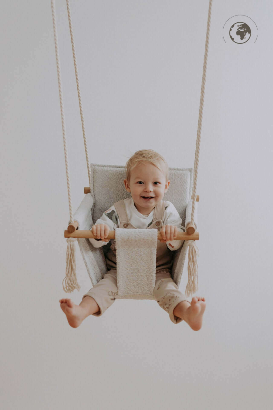 Toddler in BaBi Baby Swing Bouclé Ice Grey made from recycled materials, available on USMIH with card and cryptocurrency payments - premium online store for presents, gifts and beautiful products, Multilanguage, cryptocurrency payments