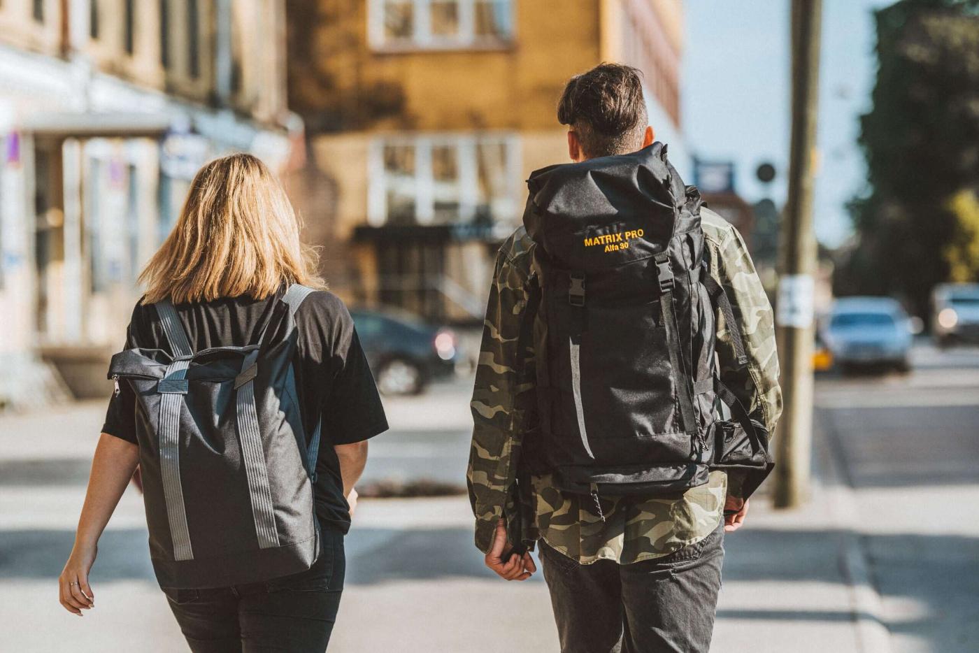 Two people walking with Matrix Pro Alfa 30 hiking bags, showcasing versatility for everyday use and outdoor adventures - avalable in USMIH Grid online store marketplace for premium European brands