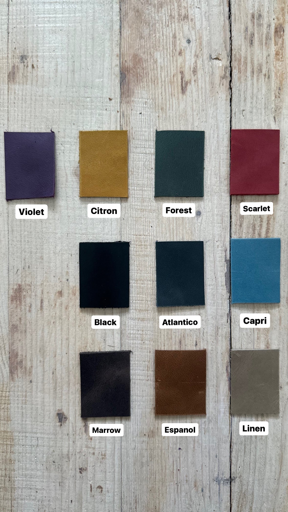 Leather color swatches for KOKUKA bag in shades like Violet, Citron, Forest, Scarlet, and more on wooden background.