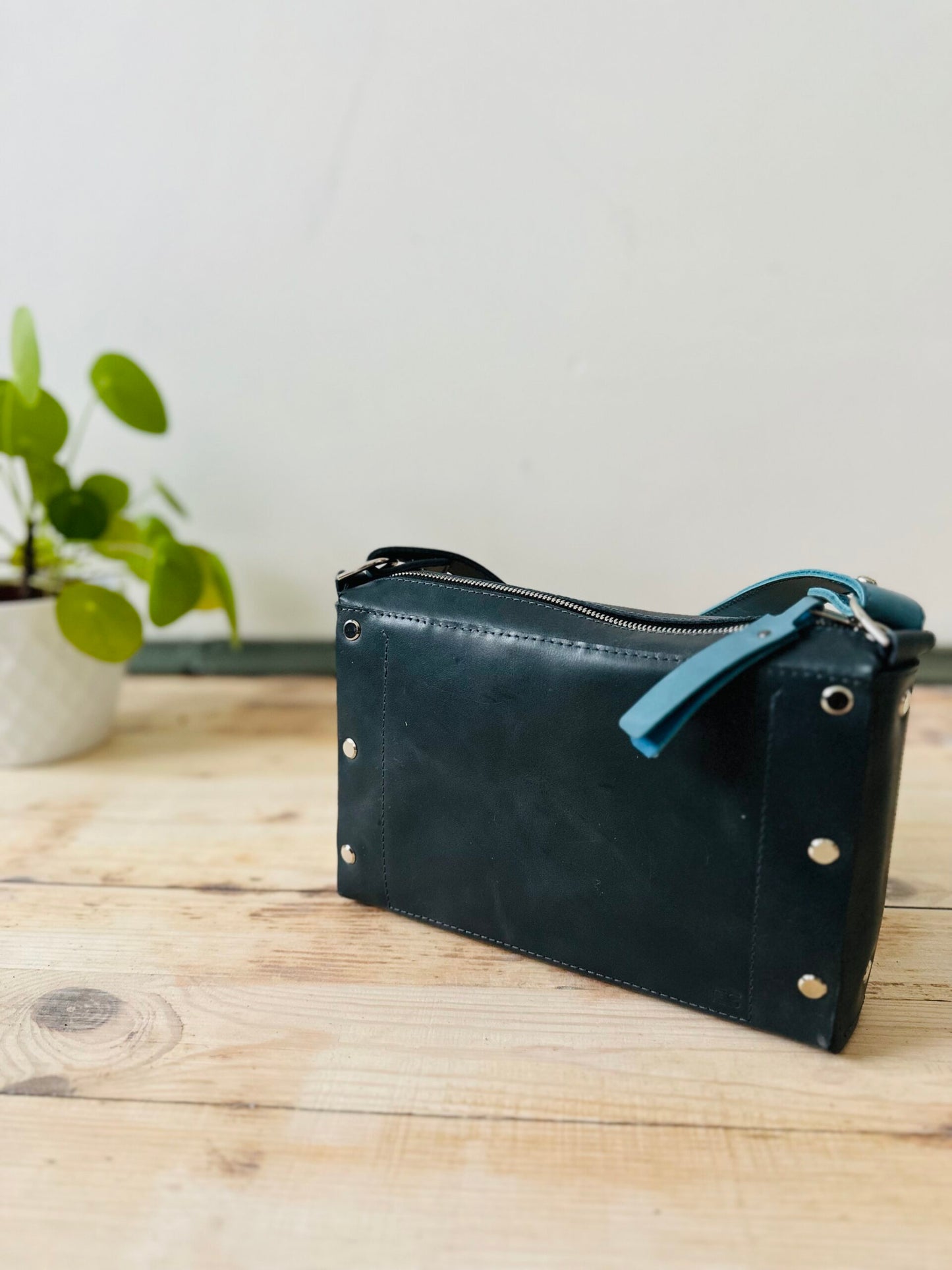 Crossbody Leather Bag TOURIST in black with zipper and adjustable strap, available on USMIH Grid. Buy with card or crypto. Join the Grid!