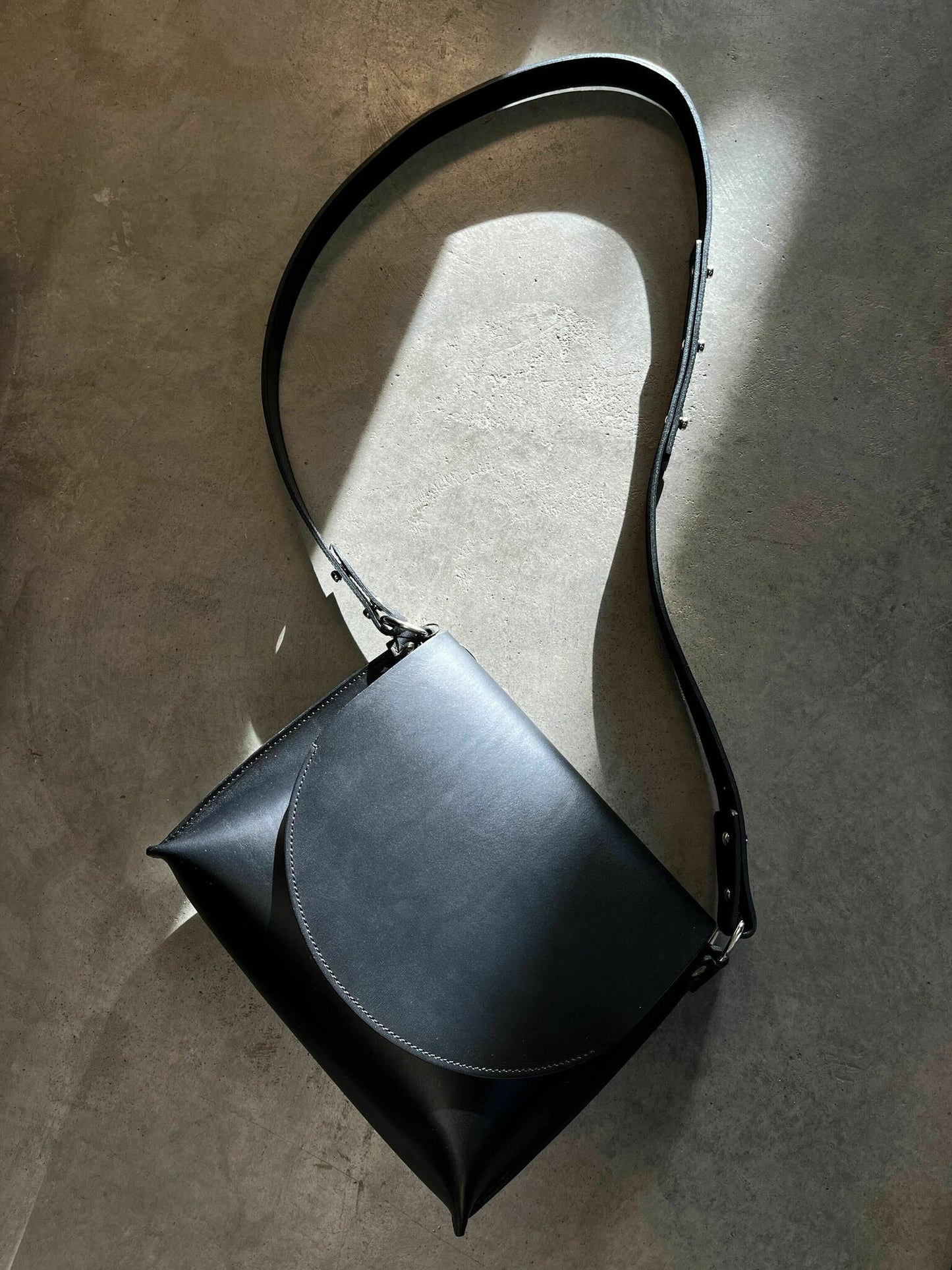 Classic leather Undercover Lover Handbag with adjustable strap, available for purchase online with card or crypto on USMIH Grid.