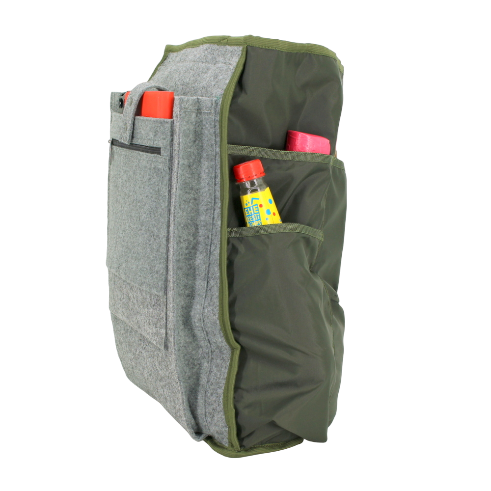 Side view of a gray and green backpack with multiple pockets, showing items like bottles and a book stored inside.