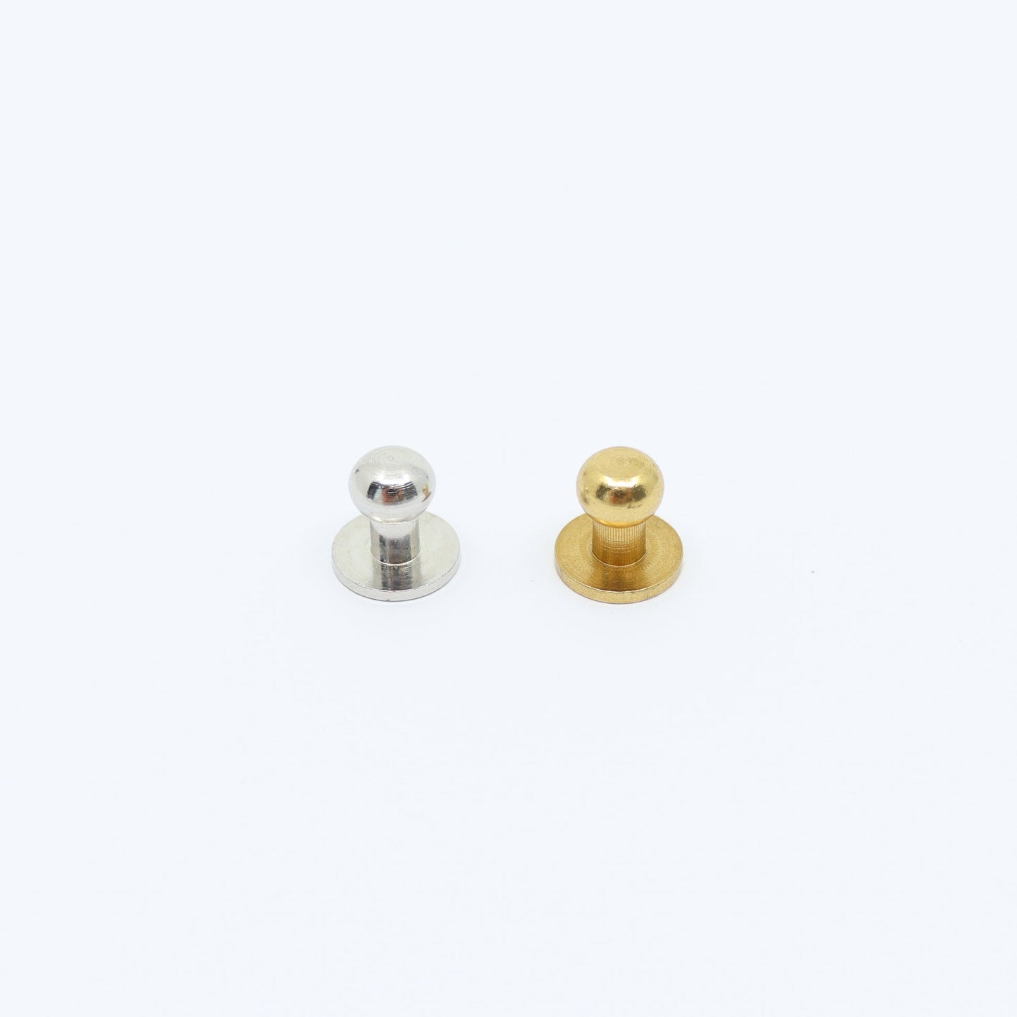 Silver and gold Sam Browne buttons for adjustable straps, ideal for leather phone bags and accessories.