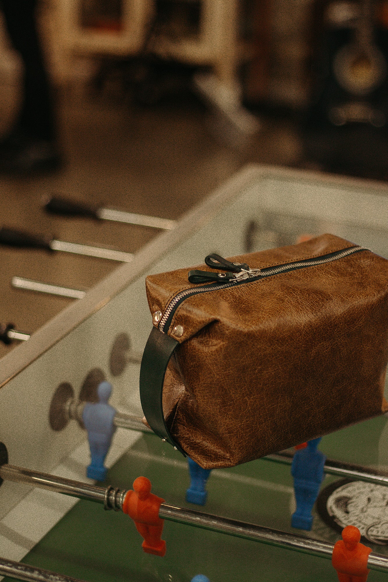 Leather Small Toiletry Bag on Foosball Table, available on USMIH Grid. Buy online with card, Bitcoin payments, and altcoins.