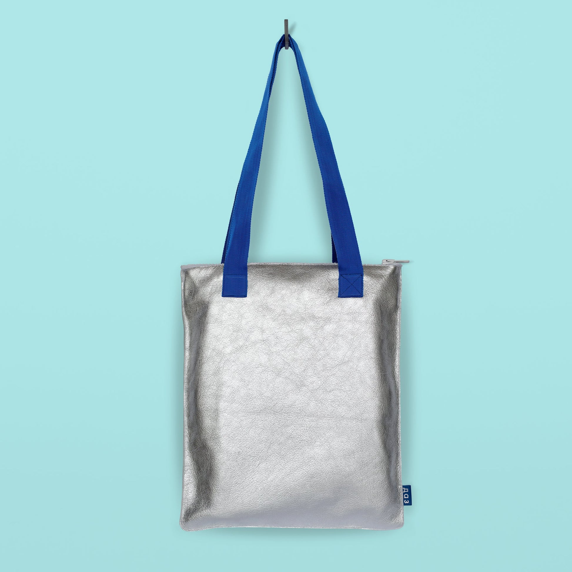 Handmade silver leather tote with blue straps on USMIH Grid, modern European marketplace. Buy with card or cryptocurrency, including Bitcoin.