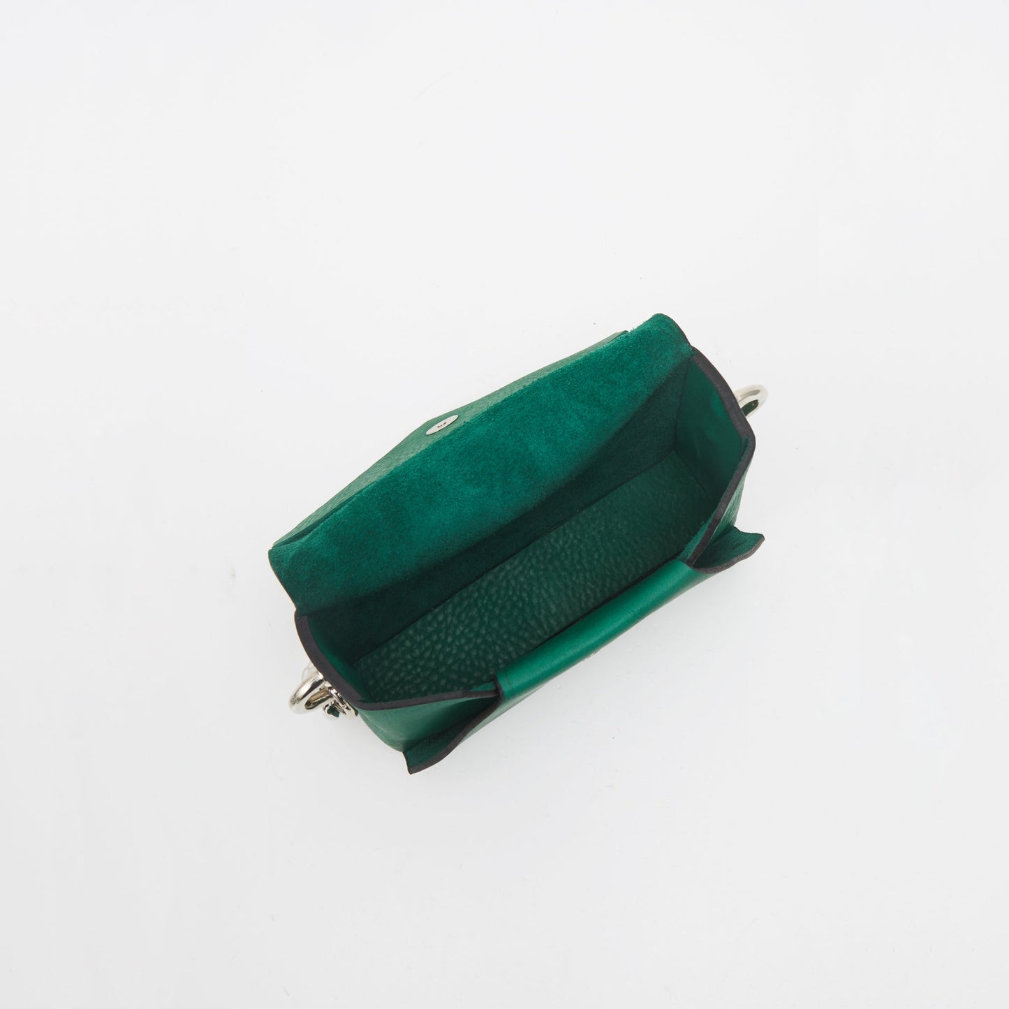 Green handmade leather envelope bag interior view, available on USMIH Grid. Purchase with card or Bitcoin. European brand.