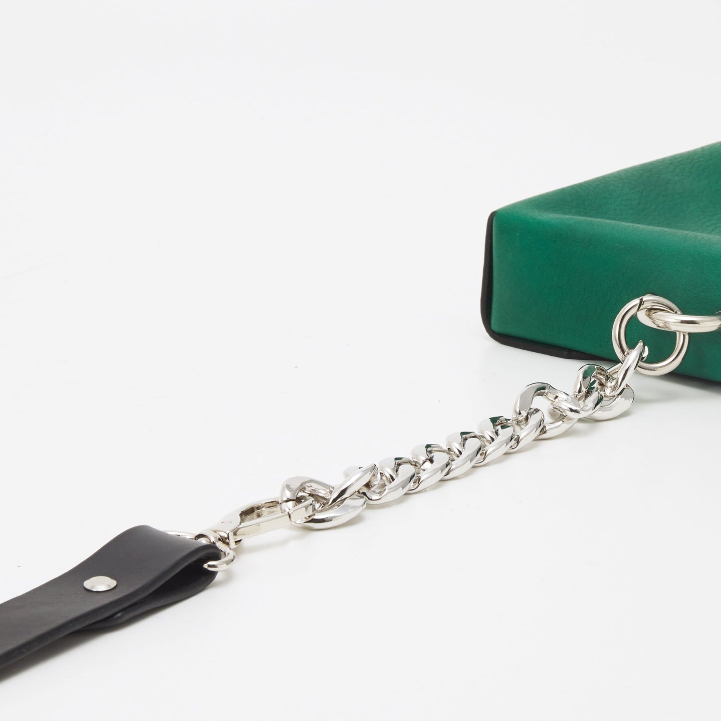 Green handmade leather envelope bag with adjustable black strap and silver chain, available on USMIH Grid for card and cryptocurrency payments.