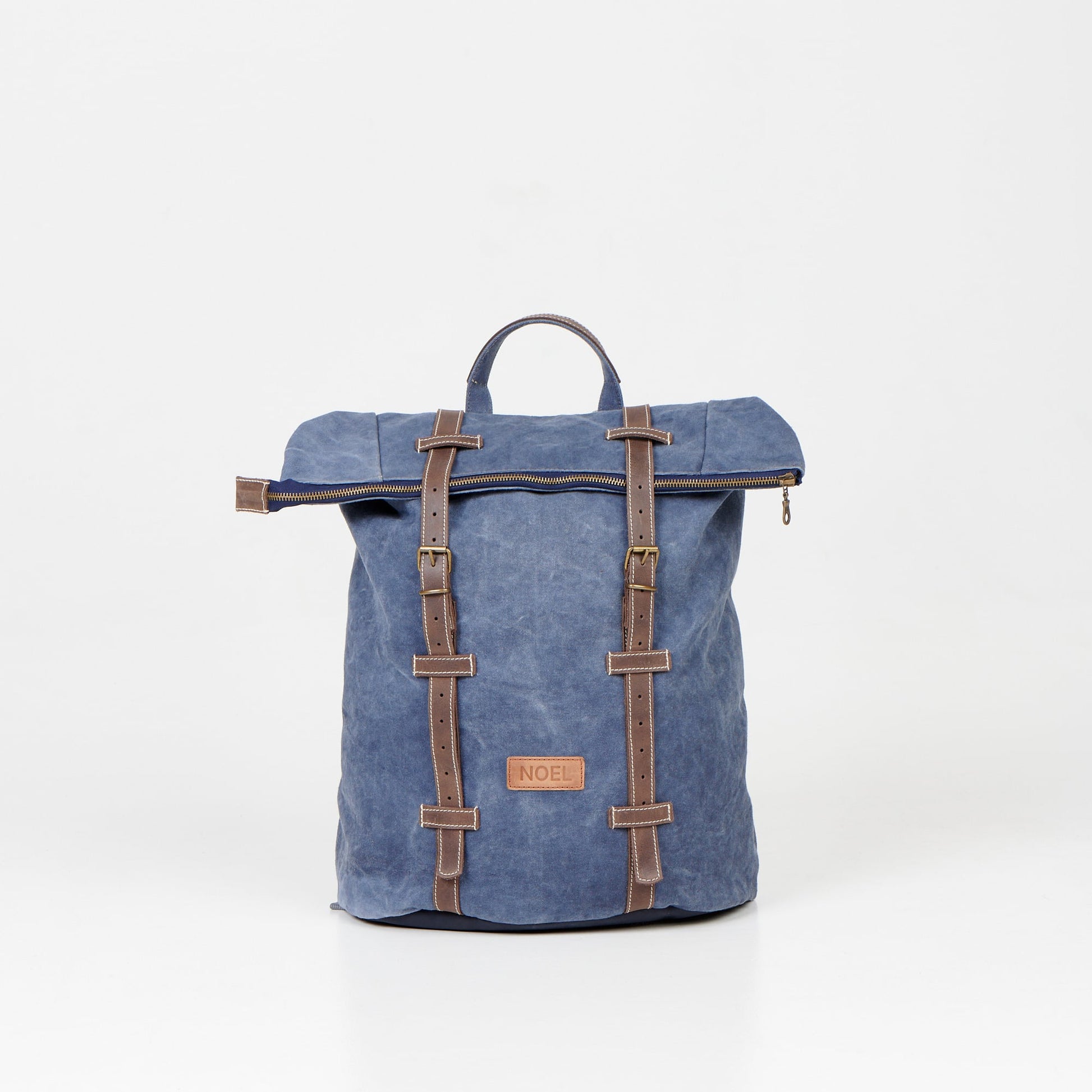 Blue NOEL ZIP Backpack with leather straps and USMIH Grid design, featuring padded laptop compartment and multiple pockets.