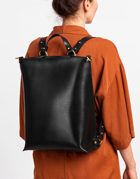 Sleek multifunctional leather backpack by Stella Soomlais, available for purchase with card or crypto on USMIH Grid.