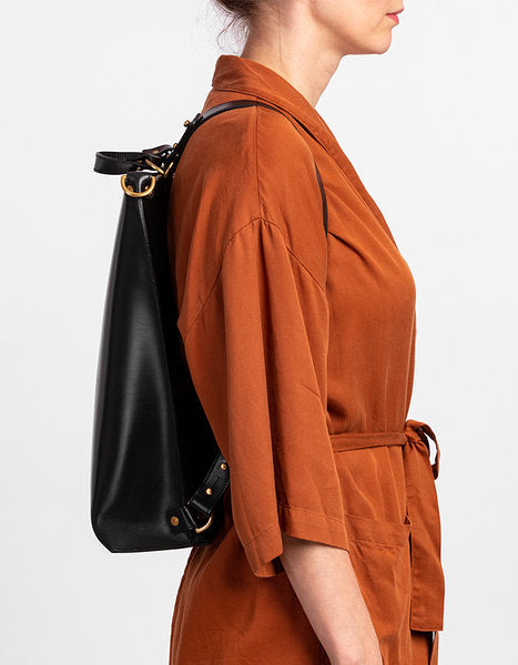 Stylish leather backpack worn as shoulder bag from Stella Soomlais, available for Bitcoin payments on modern marketplace USMIH Grid.