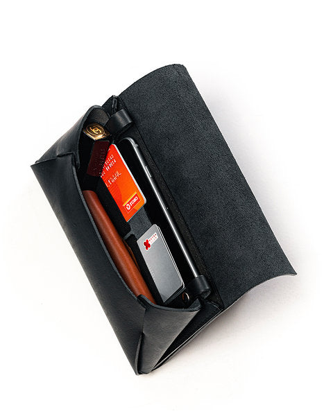 Capital of Plenty Clutch/Wallet with cards and phone inside, luxury leather design, available on USMIH Grid | Join the Grid!