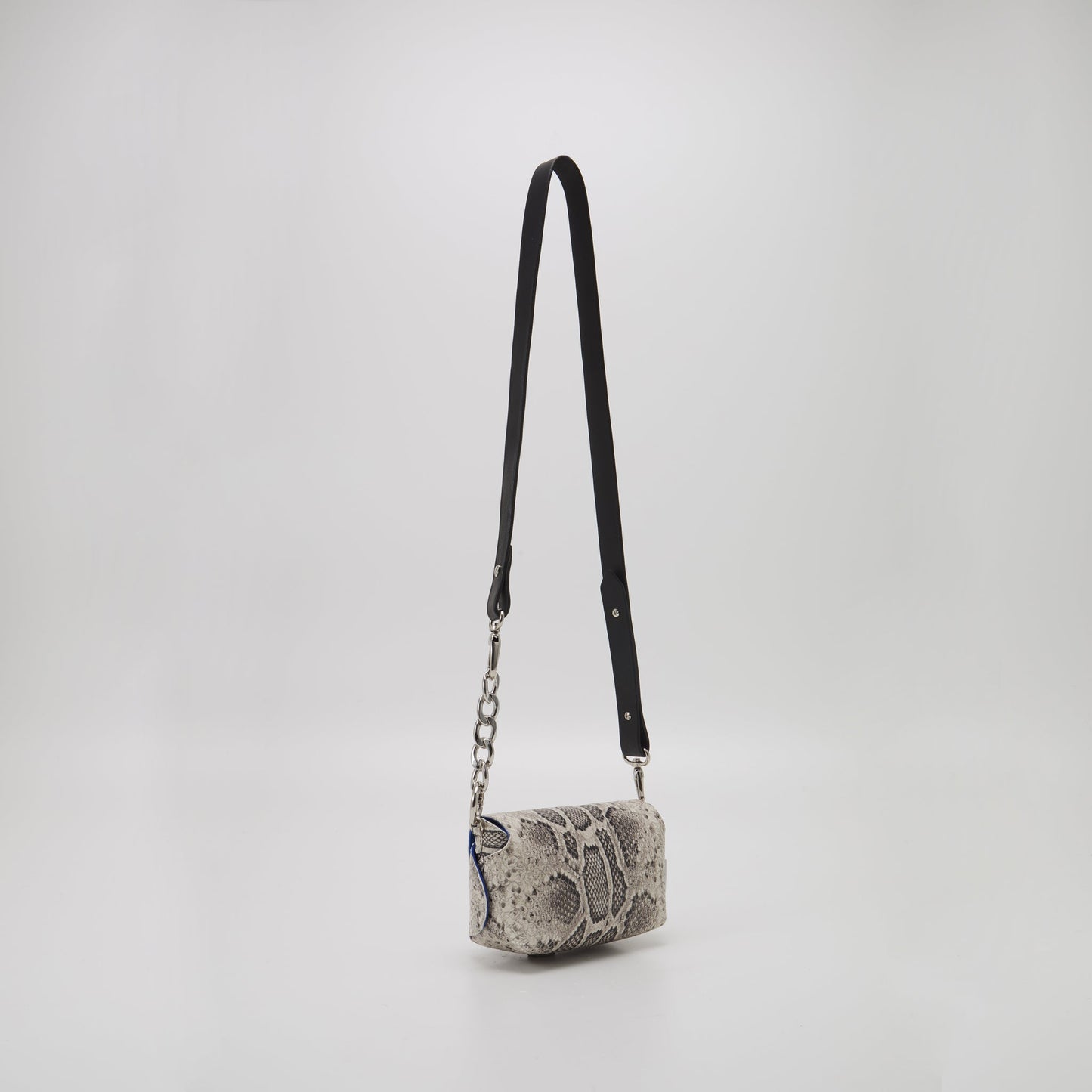 Handmade leather snake print crossbody bag with adjustable strap, available on USMIH Grid for card and cryptocurrency payments.