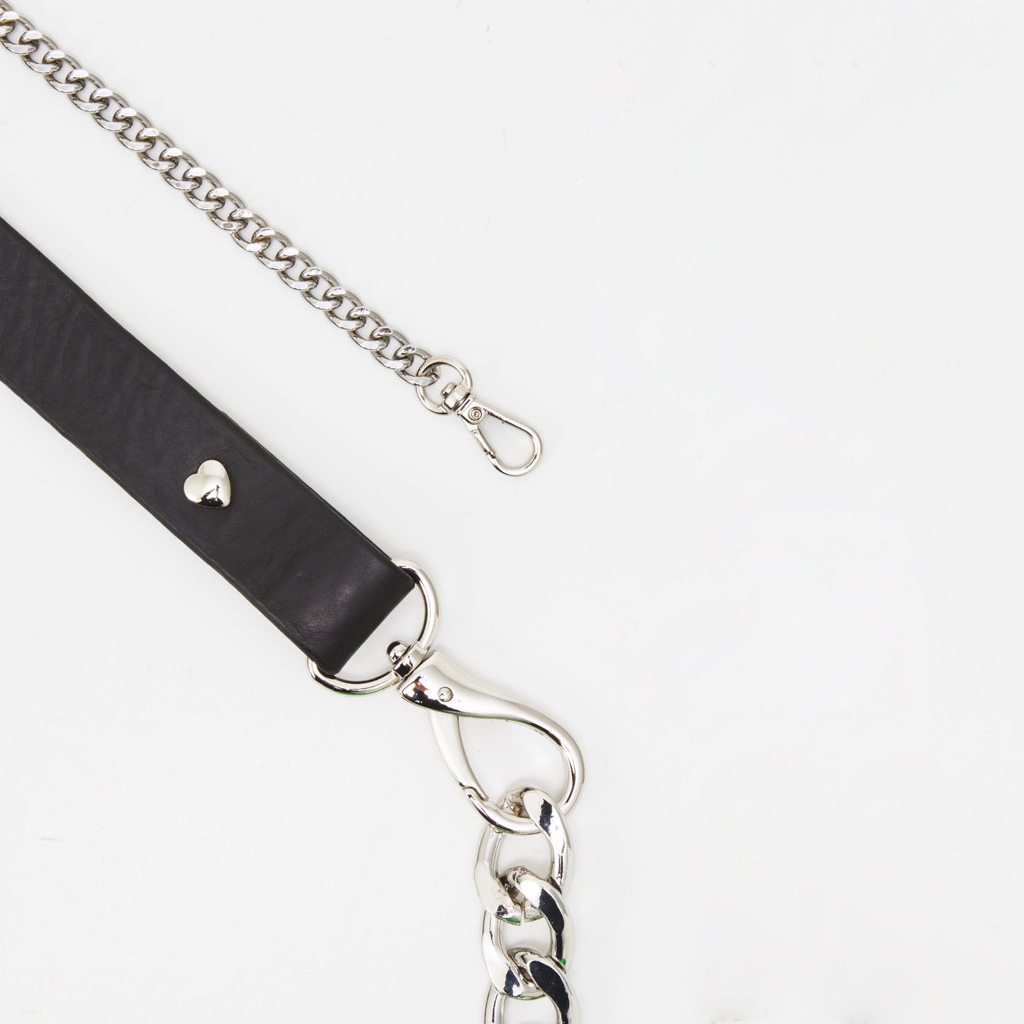 Leather and metal strap with shiny silver hardware, part of versatile handmade leather bag available on USMIH Grid for card or crypto payment.